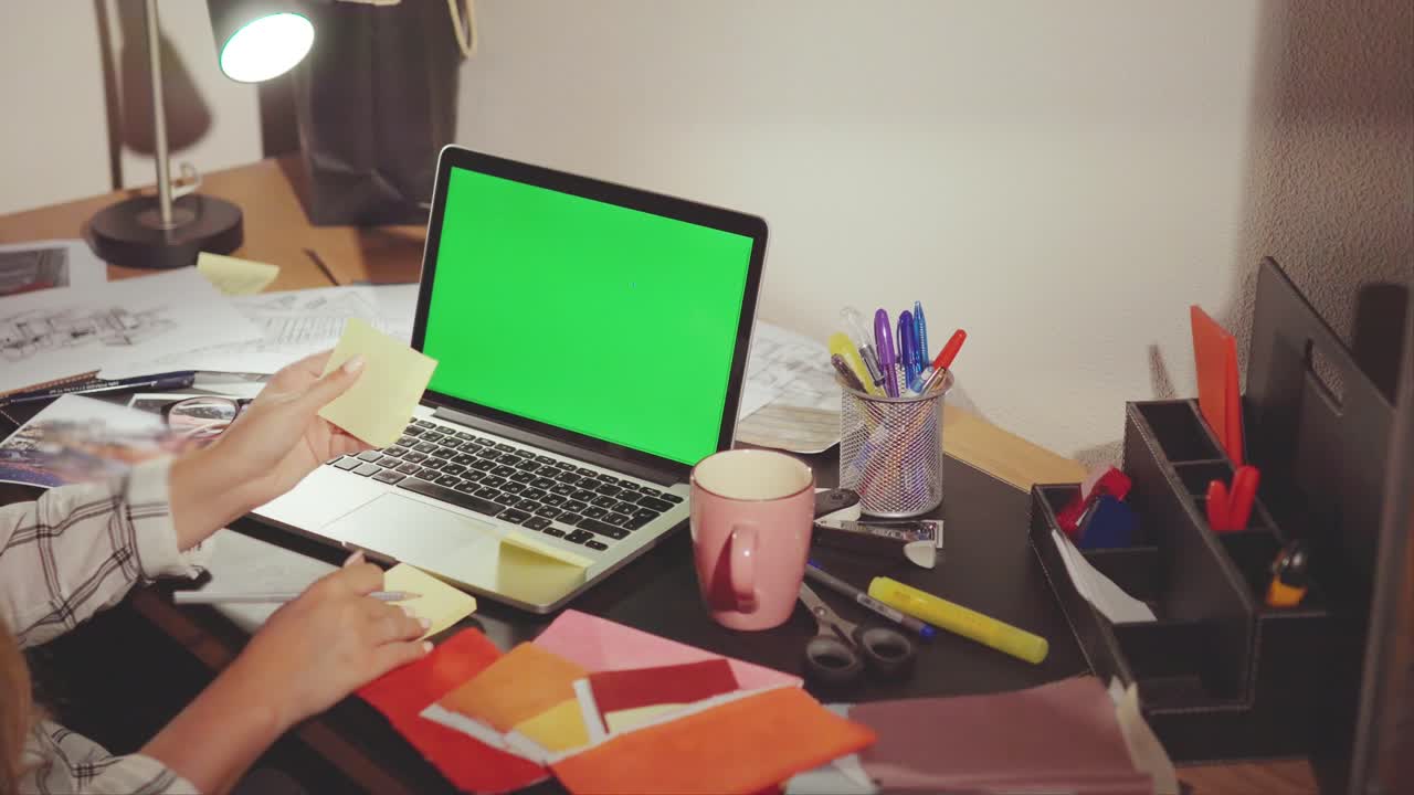 Designer Working on a Project at Night