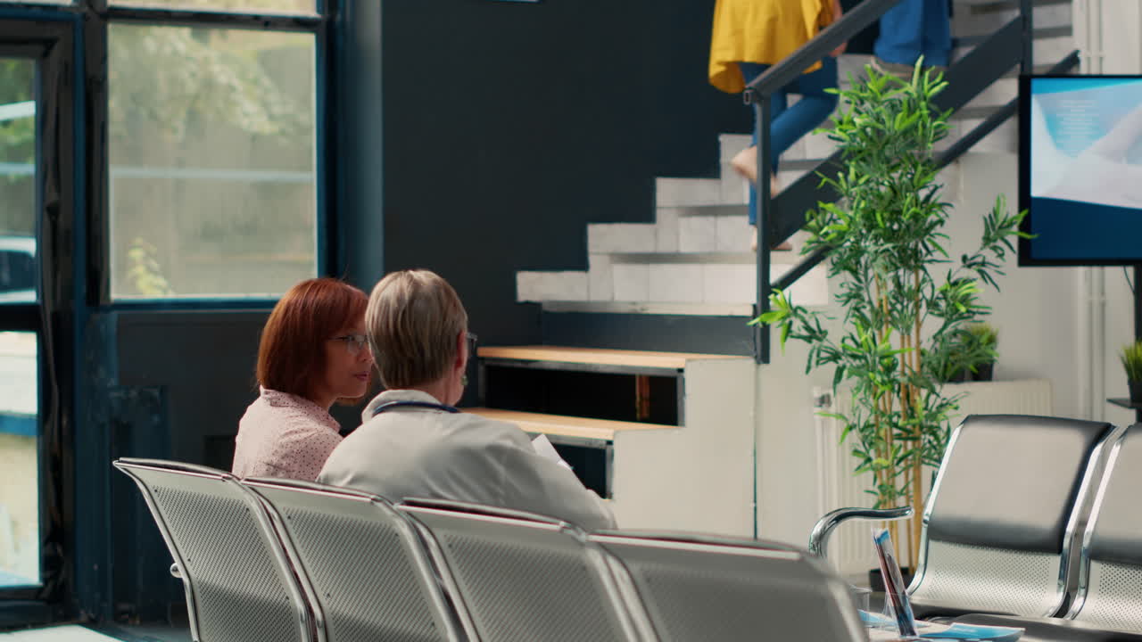 Waiting room with doctor and patients in hospital