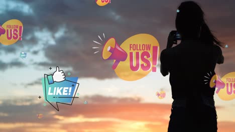 animation of follow us over midsection of woman taking photo with smartphone at sunset