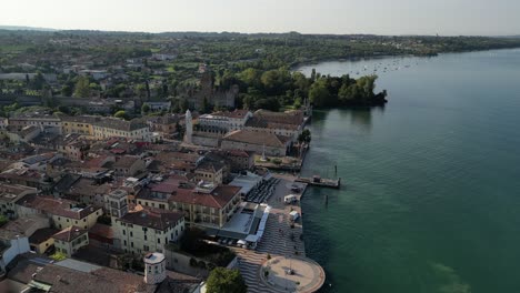 drone footage of italian city and promenade on the water