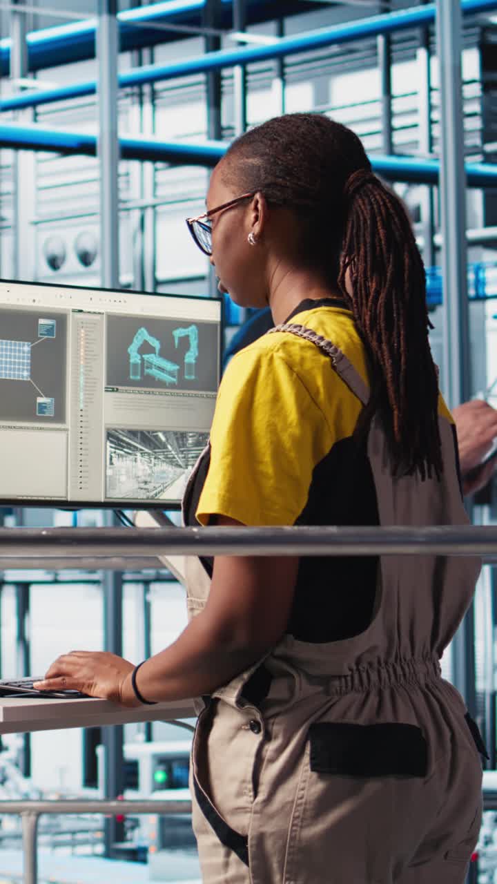 Vertical video Portrait of happy engineer in photovoltaics smart factory analyzing data