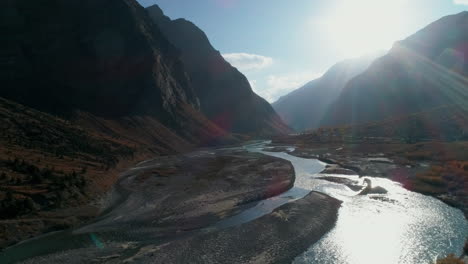 surreal autumn evening in a vast mountain valley with glacial river streams flowing in the landscape. great himalayas of lahaul spiti, asia