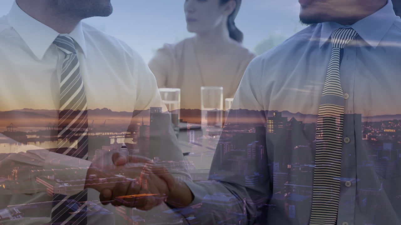 다양한 사업가들이 사무실에서 손을 흔들고 있는 디지털 구성 도시 풍경의 공중 전망