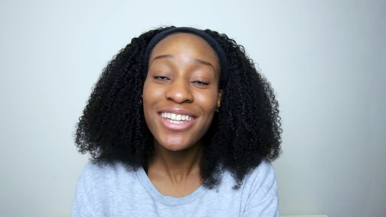 Young Student Greeting and Talking Directly to Camera