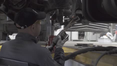 auto mechanic repairs truck suspension