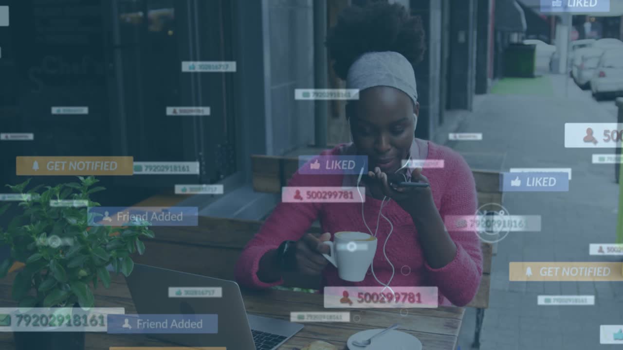 Animation of social media notifications over african american woman using smartphone at street cafe