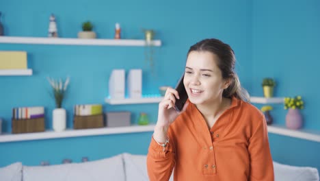 Young-woman-talking-on-the-phone-angry-and-hurtful.