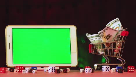 new years video screensaver cart of dollars and a tablet with a green screen.