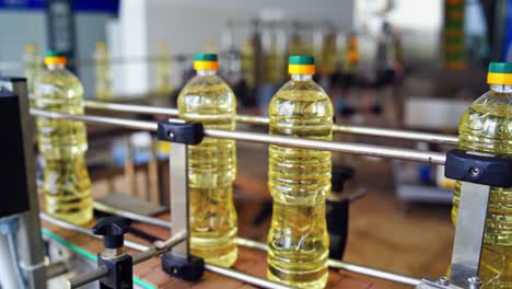 interior of modern natural oil factory. bottling the sunflower oil into plastic container