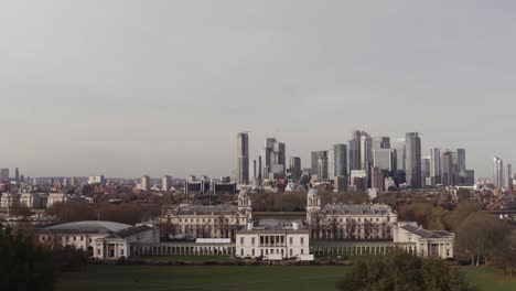 a view of greenwich, maritime museum, canary wharf and london from the top of the observatory