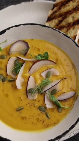 creamy pumpkin soup with coconut and toasted bread