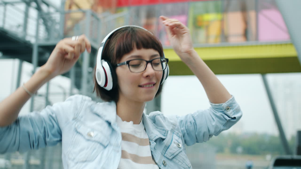 Woman Dancing to Music Outdoors
