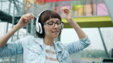 woman dancing to music outdoors