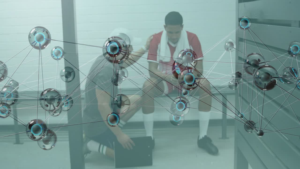 Coach kneeling beside and consoling postgame athlete on bench, network overlay floating over scene