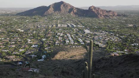 Profile-view-of-Paradise-valley-on-a-sunny-day-in-Arizona,-USA-with-cactus-in-foreground