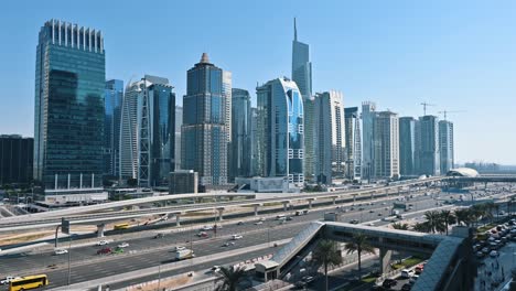 timelapse: traffic flows along dubai's sheikh zayed road, with a view of jumeirah lake towers in the uae