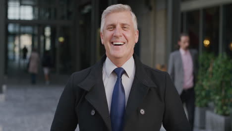 portrait successful senior businessman executive laughing clapping hands enjoying professional career success happy middle aged entrepreneur looking happy in city slow motion