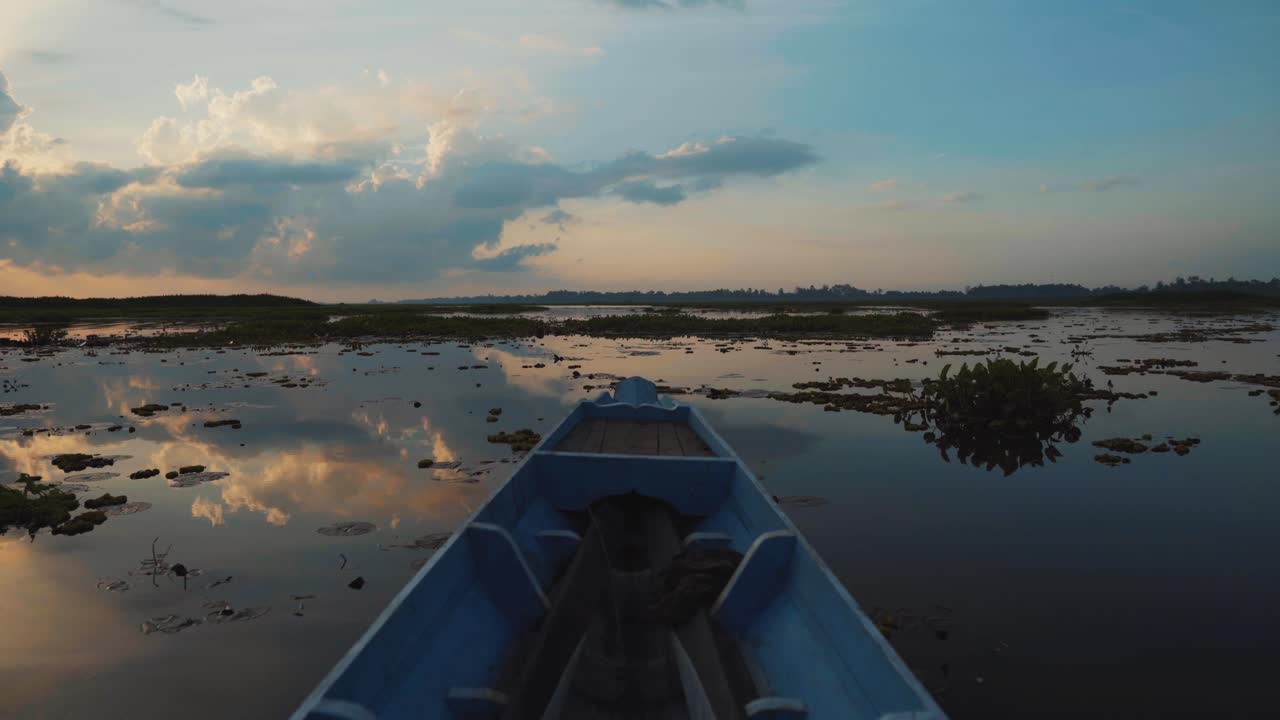 Sunset view from a boat on a calm lake