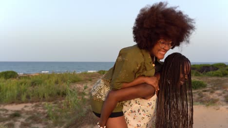 black female friends having fun on beach