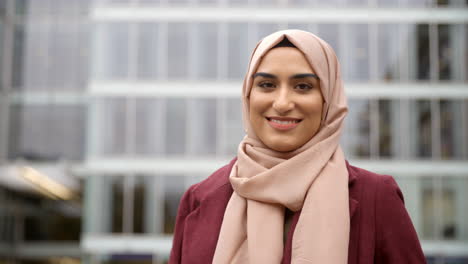 portrait of british muslim businesswoman outside office