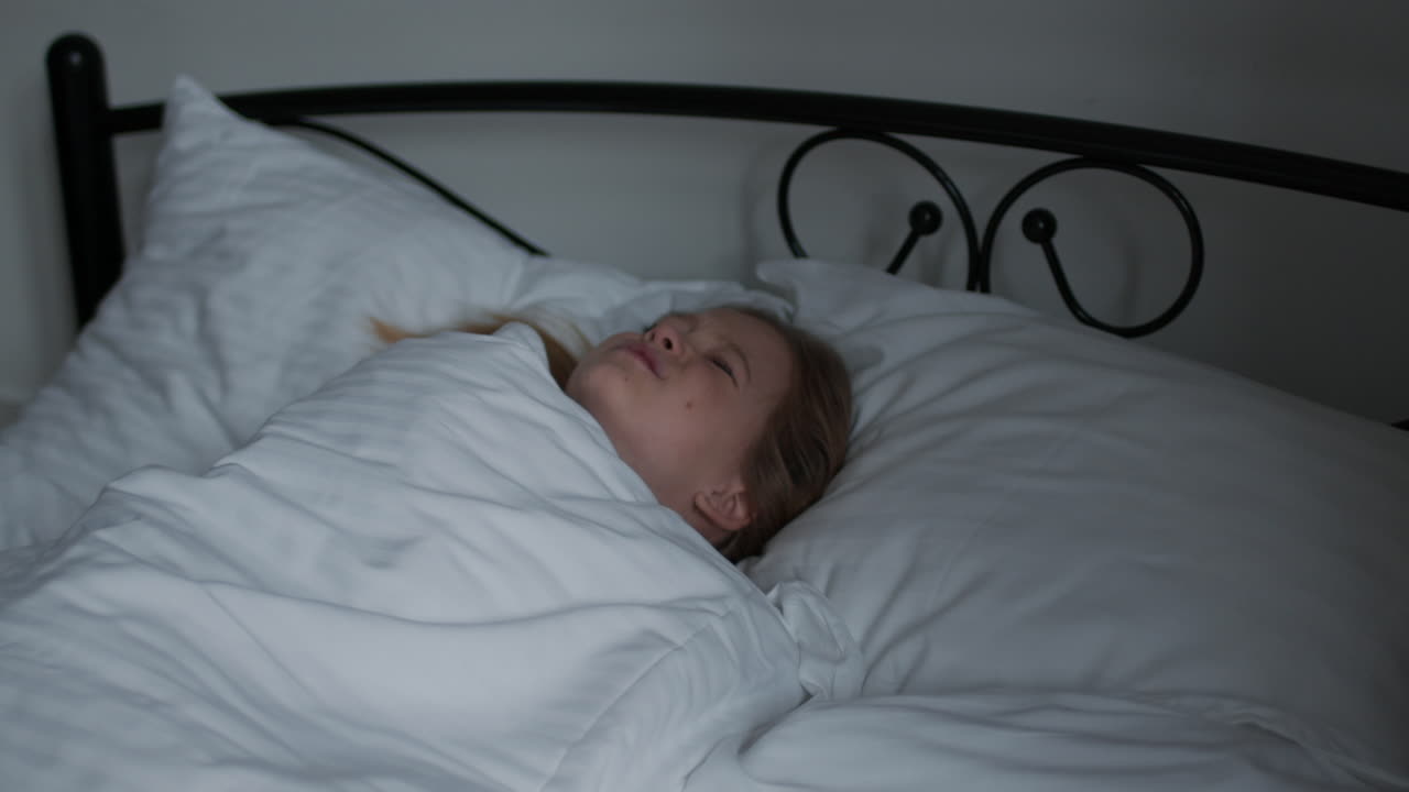 Girl Sleeping in Bed at Night