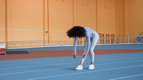 Woman-stretching-indoors