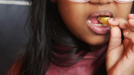 young girl eating french fries