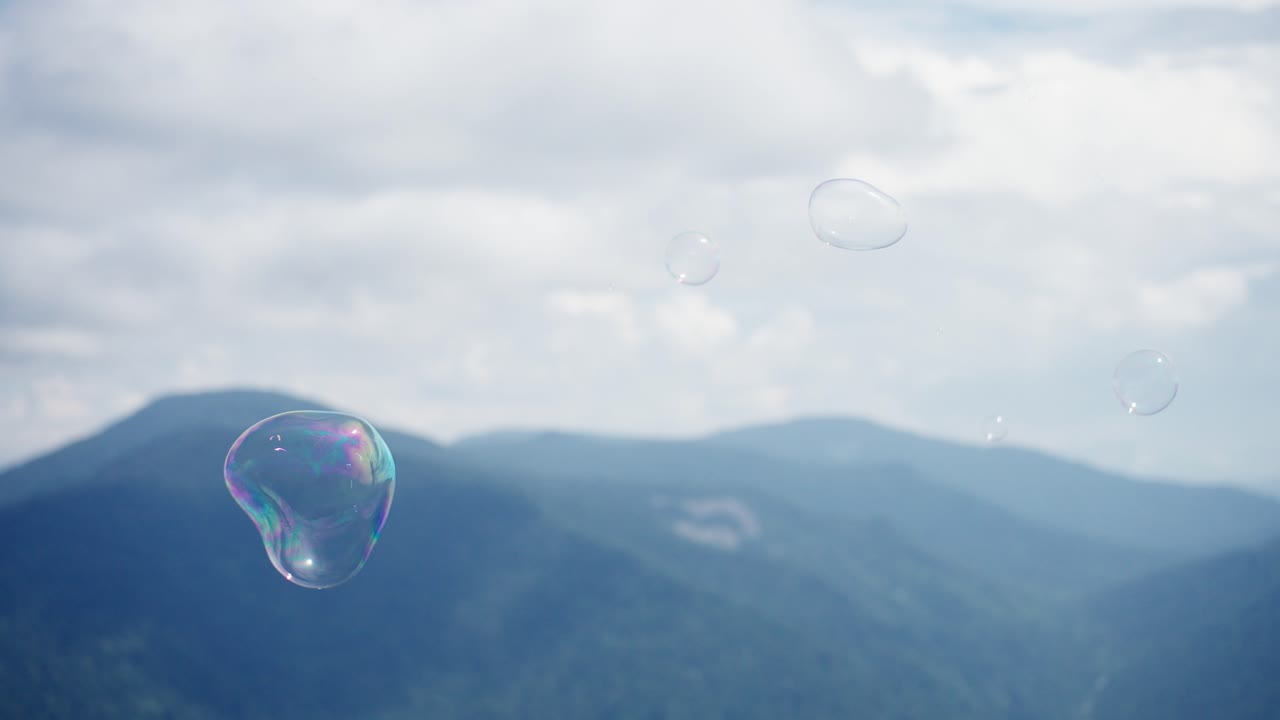 Soap Bubbles over Mountains