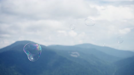 soap bubbles over mountains