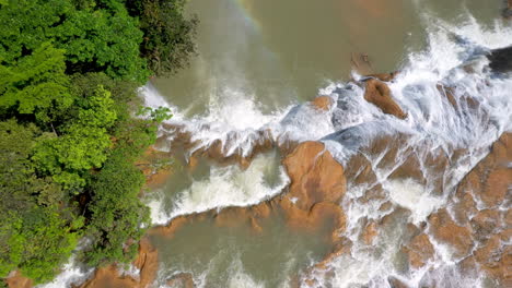 tilting downward drone shot drone shot of the waterfalls found at cascadas de agua azul on the xanil river in chiapas mexico