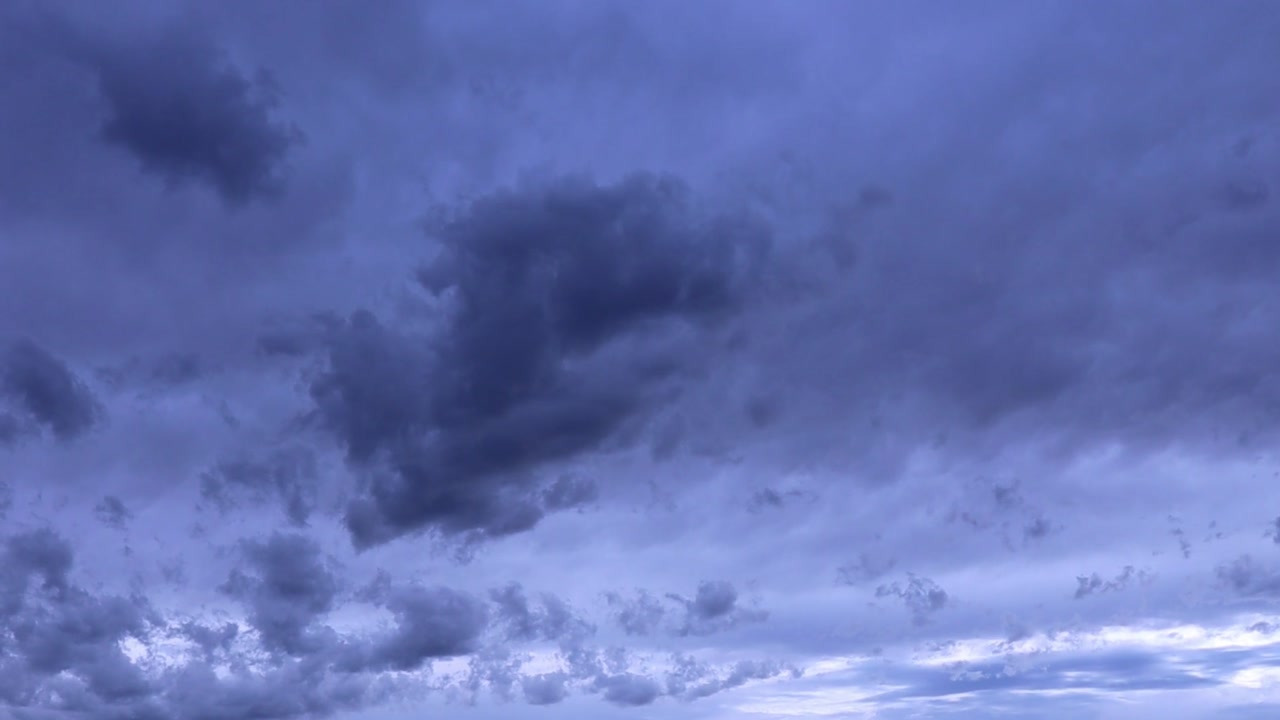 A dramatic and moody sky filled with dark, heavy storm clouds hinting at changing weather.