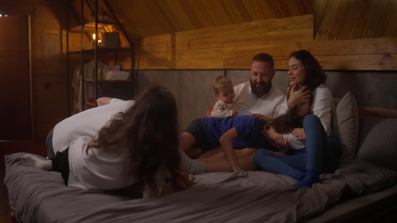 A family enjoying time together on a cozy bed