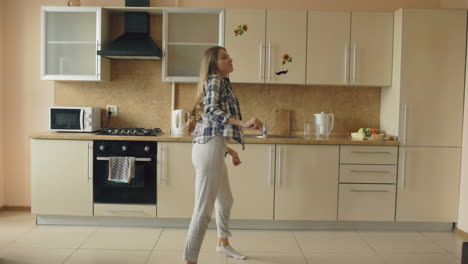 woman dancing in kitchen