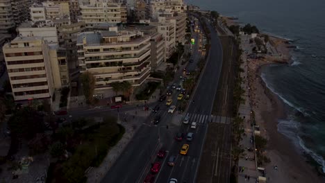 busy twilight traffic in flisvos, palaio faliro, athens, greece