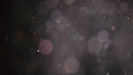 floating abstract particle bokeh on dark background