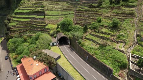 seixal village terraced hillside aerial view circling joão delgado mountain road tunnel entrance