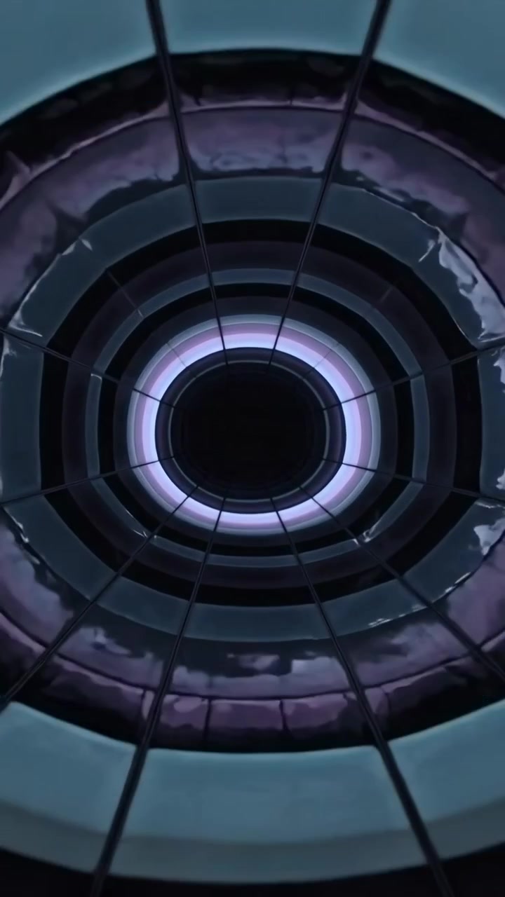 Video verticale: Telecamera che inizia uno zoom lento mostrando anelli a cupola colorati nell'atrio, rivelando l'anello interno.