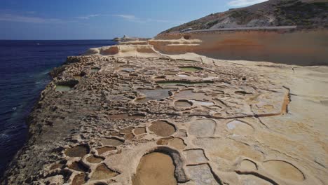 low wide dolly of salt pans on gozo island, malta