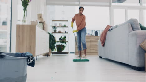 Woman,-mopping-or-cleaning-living-room-floor