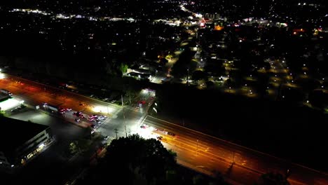 a high angle aerial view of an intersection at night