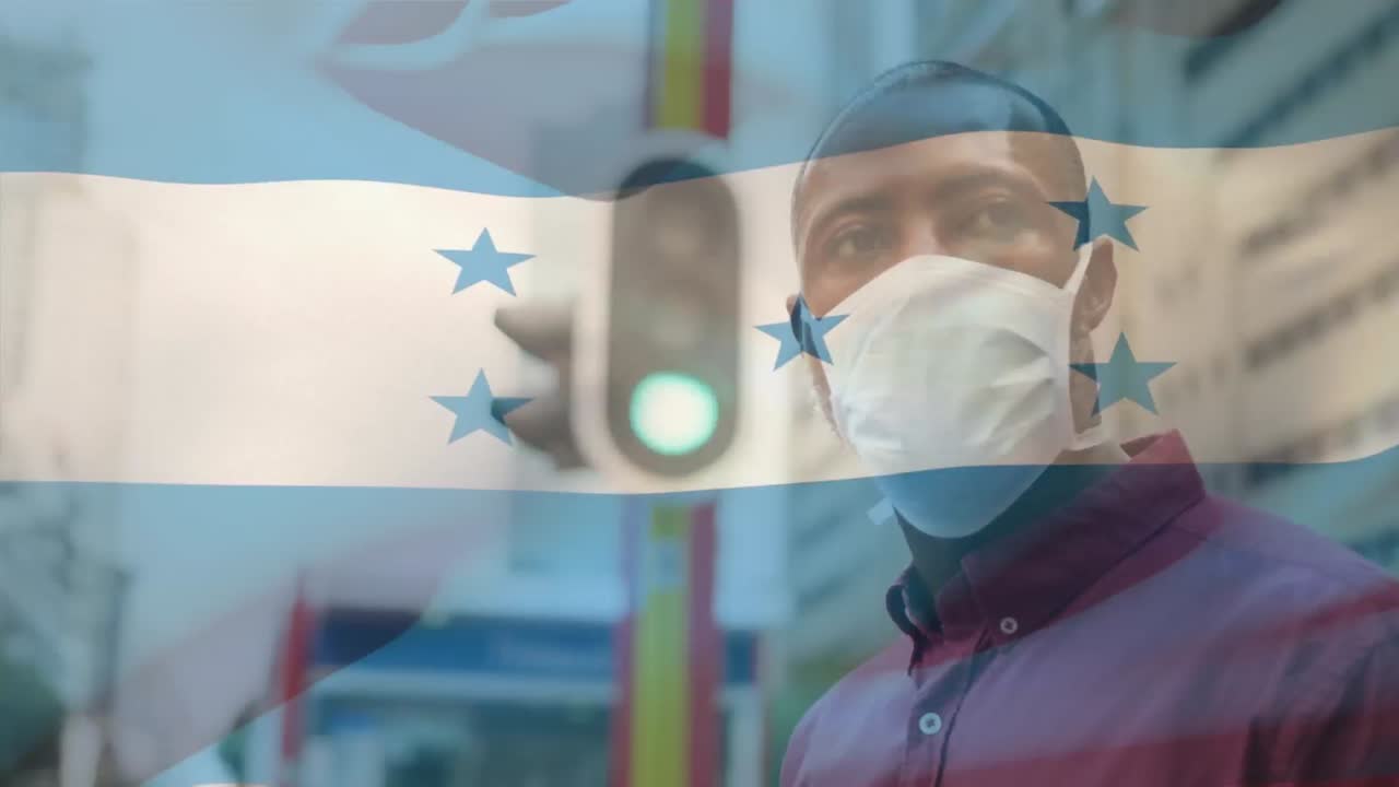 Animación de la bandera de Honduras ondeando sobre un hombre con mascarilla durante la pandemia de COVID-19
