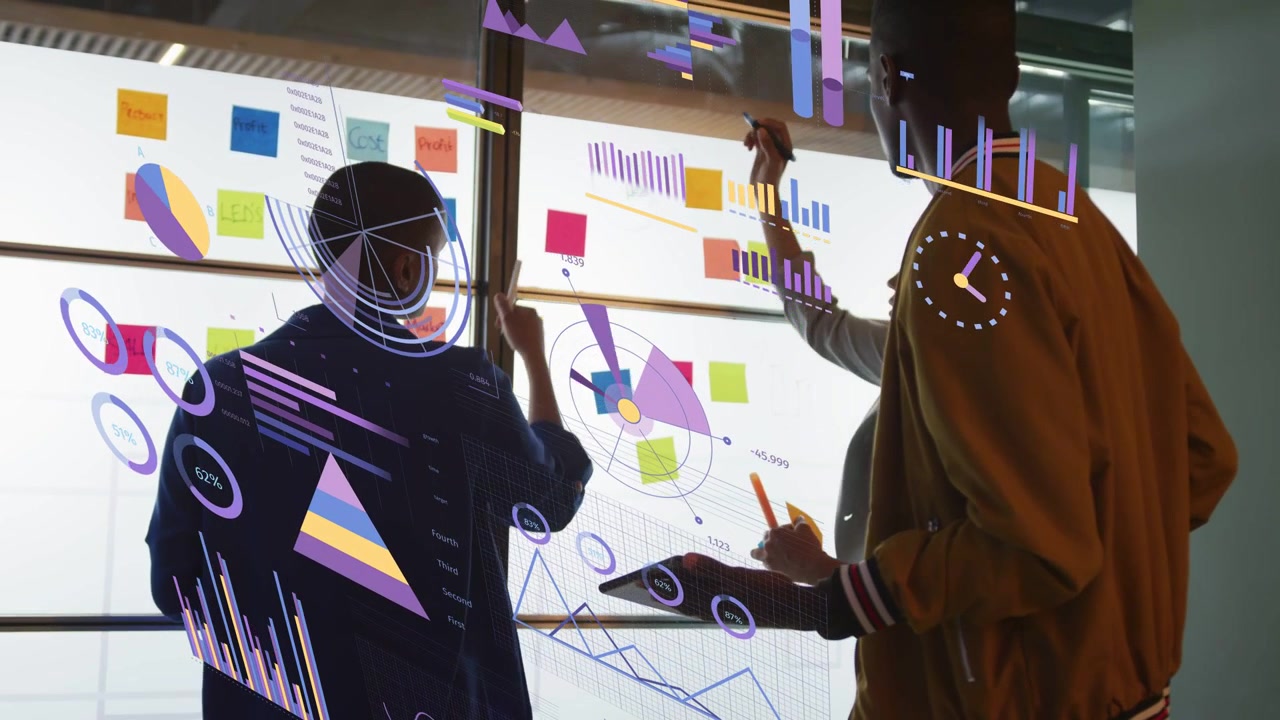 Two women writing glass while man arriving with tablet moving notes, live charts refining strategy