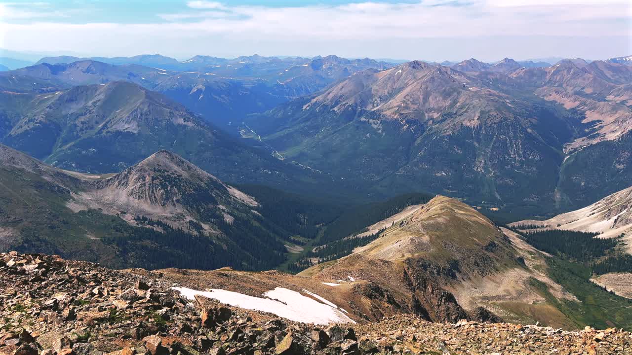 La Plata Peak Gulch Trail 14er view of Independence Pass Sawatch Range 14er spring summer Rocky Mountains Colorado high alpine elevation above treeline hiking trail morning blue sky haze pan left
