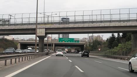 highway traffic under overpass in city