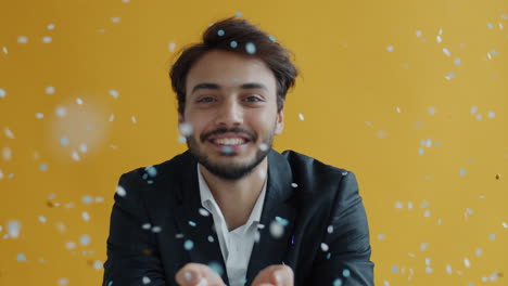man celebrating with confetti