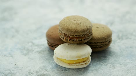 delicious macarons pastries on marble