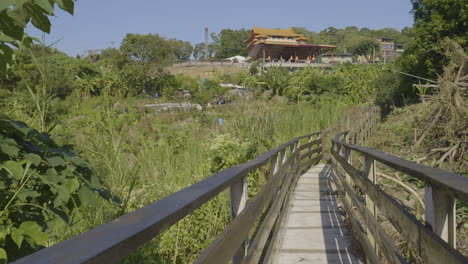 wooden trail toward countryside temple, taiwan