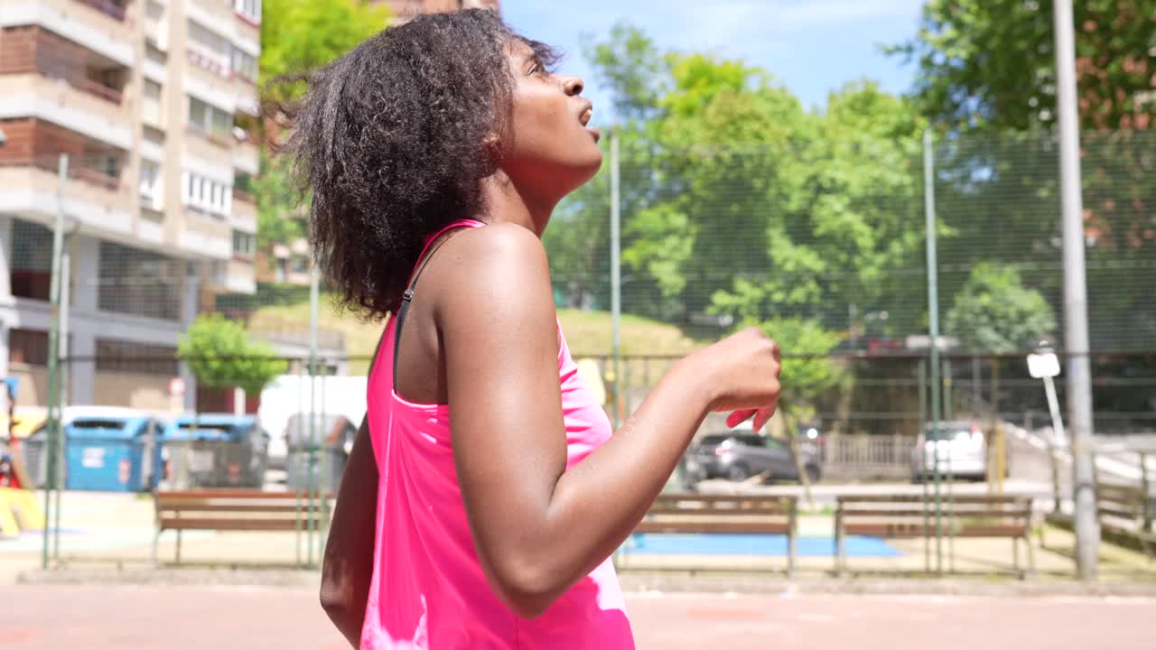 Active woman exercising in urban playground