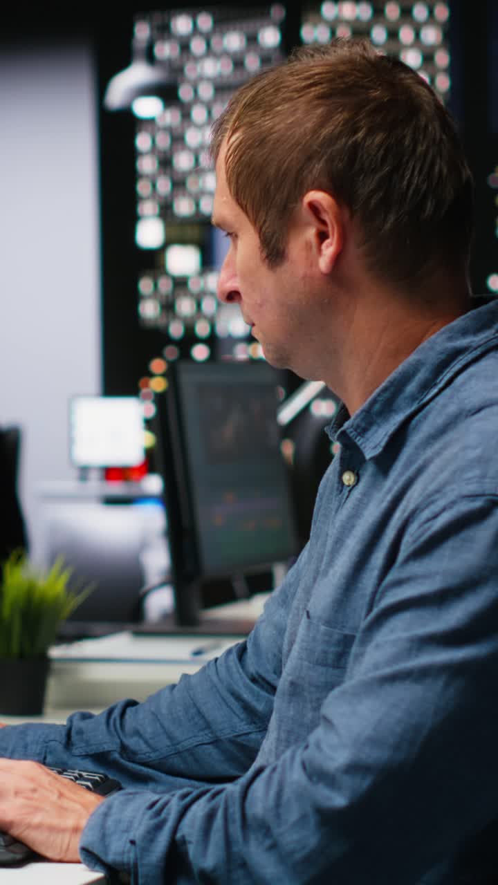 Vertical Video IT engineer checks AI game lobby and turbine to develop a new application