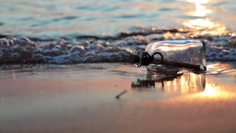 message in the bottle against the sun setting down